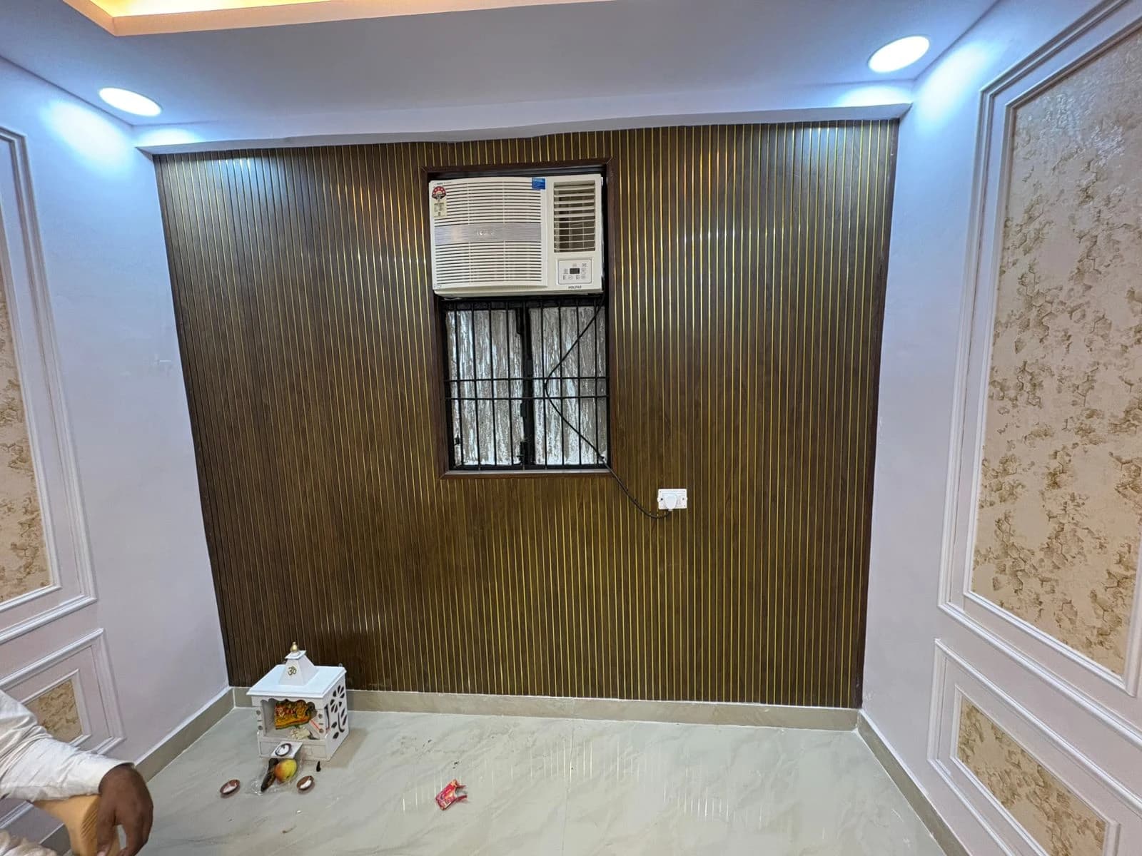 Window AC installation with decorative PVC wall paneling and LED spot lights in Lucknow by Prajapati Electrical
