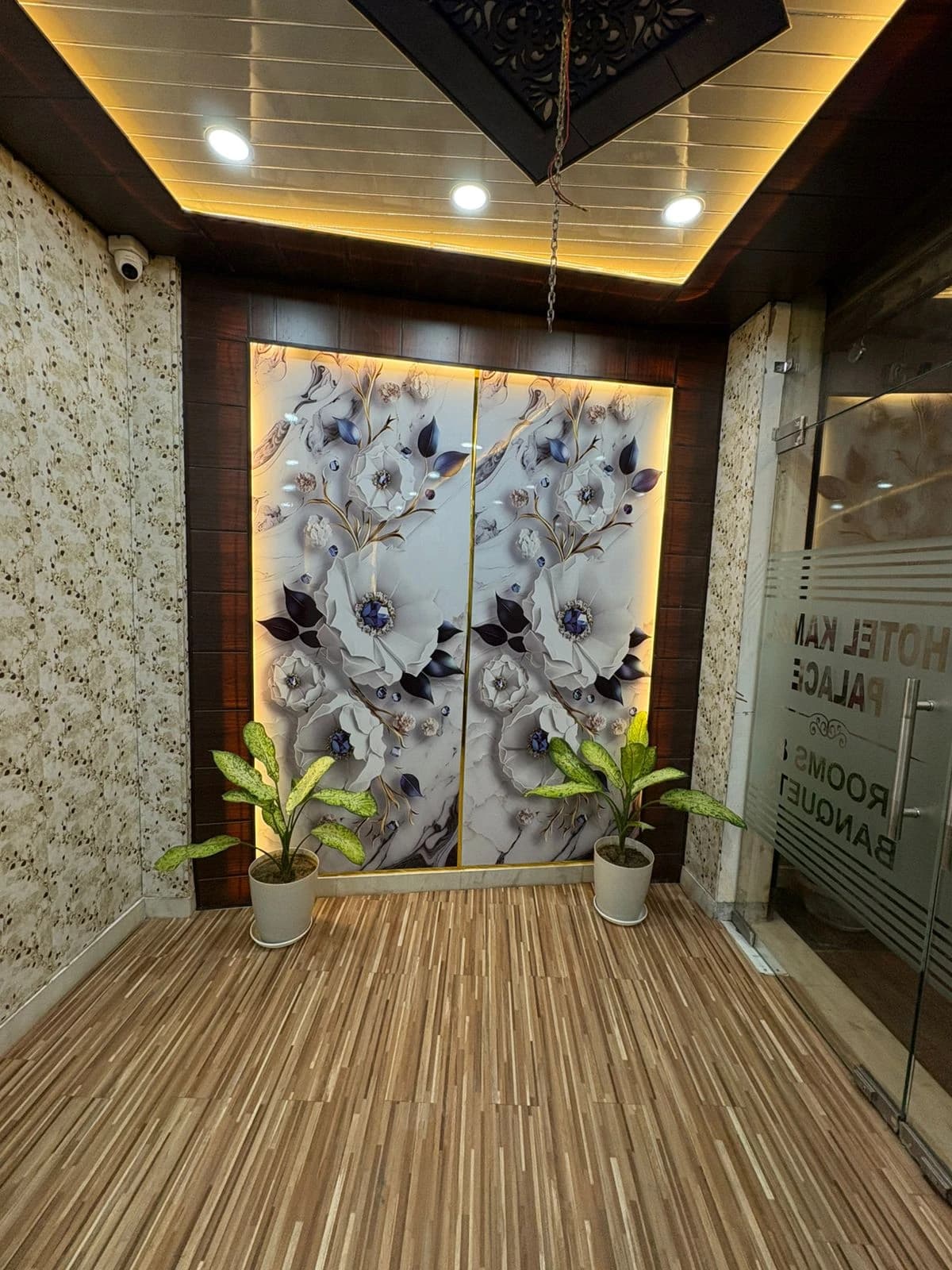 Beautiful entrance lighting with backlit wall art and false ceiling for hotel in Lucknow by Prajapati Electrical