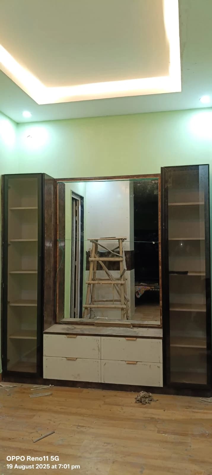 Custom dressing unit with mirror, glass shelves and LED false ceiling installation in progress in Lucknow by Prajapati Electrical