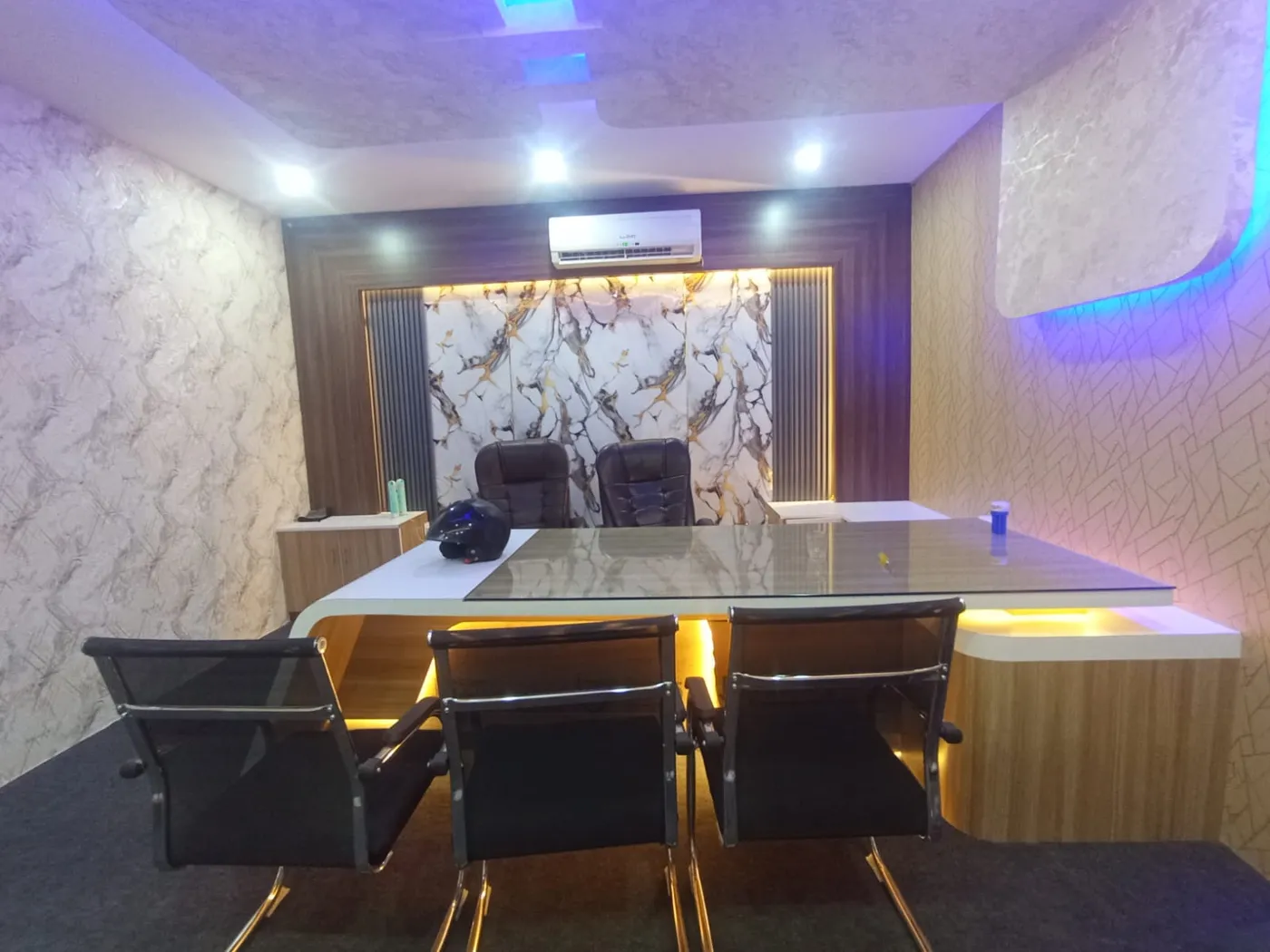 Fully finished office cabin with conference table, AC, false ceiling and marble walls in Lucknow by Prajapati Electrical