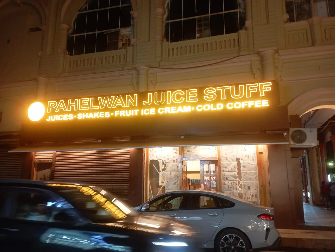 Bright illuminated signboard and facade lighting installed for a juice shop in Lucknow by Prajapati Electrical